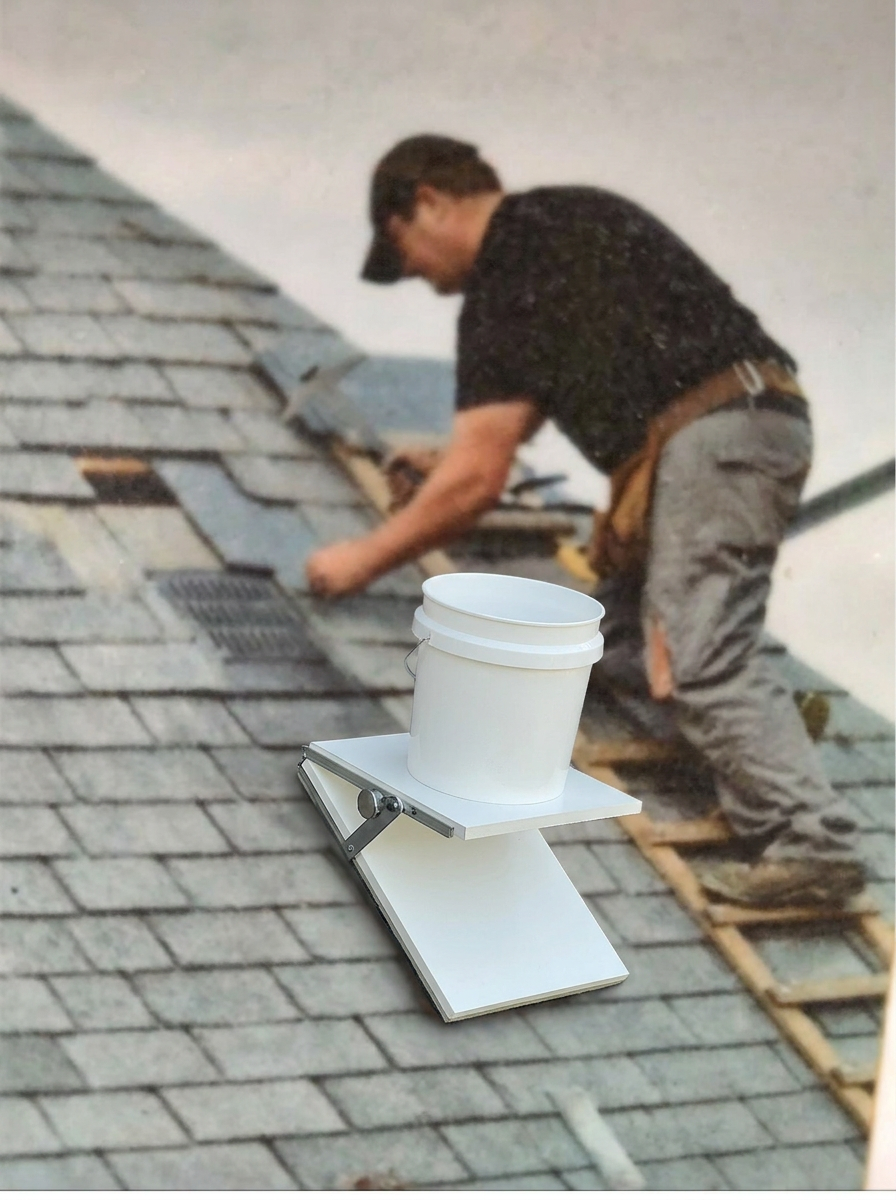 Roofer with the Roof Caddy holding a bucket on shingles